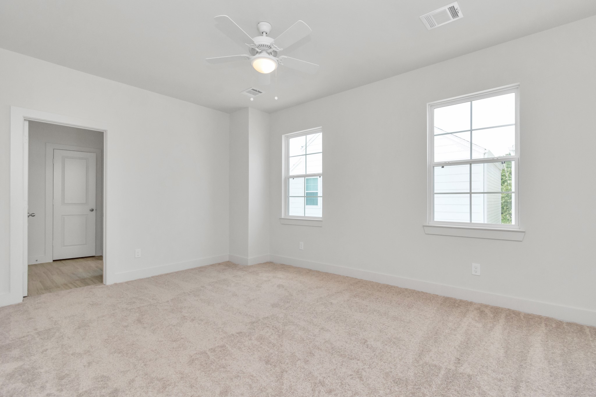 2011 East Bauer Drive Houston, TX 77080 - Photo 21 of 32 an empty room with windows and fan