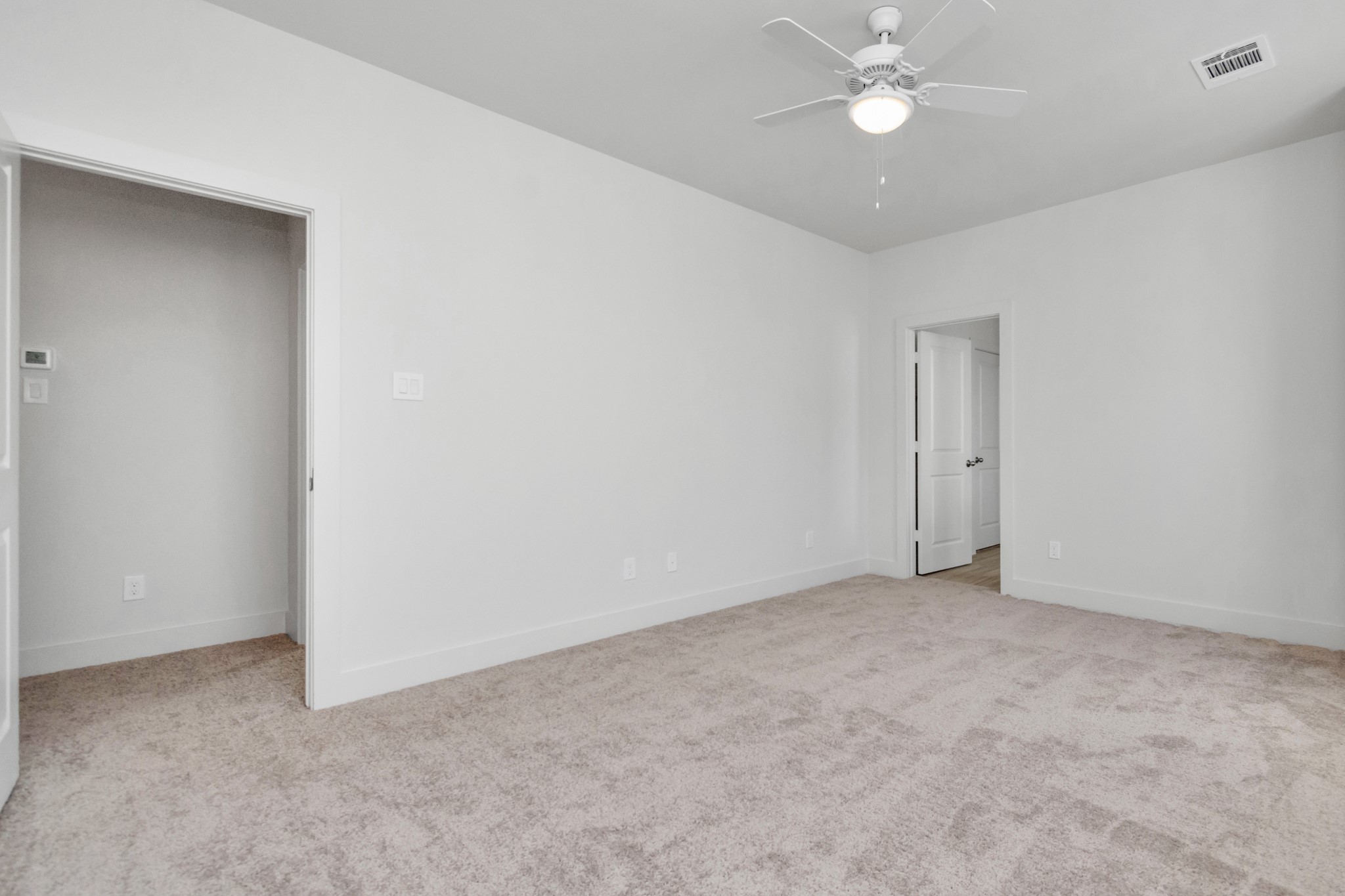 2011 East Bauer Drive Houston, TX 77080 - Photo 22 of 32 an empty room with a ceiling fan and a fan