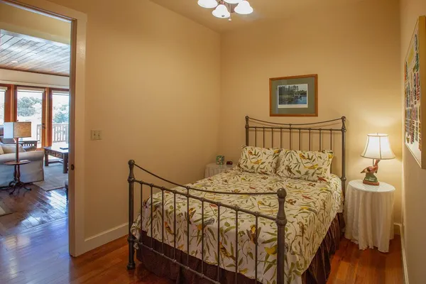 a living room with furniture and a gym machine
