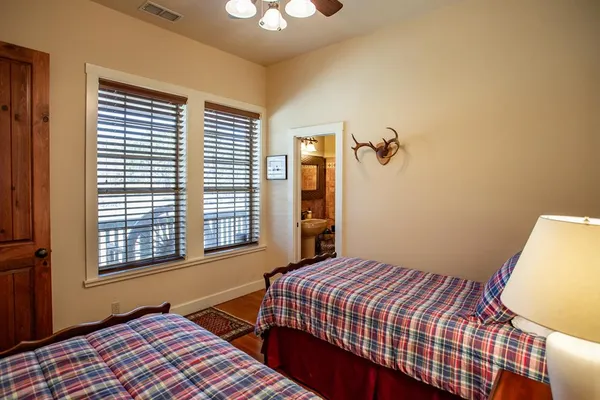 a view of a backyard with large trees