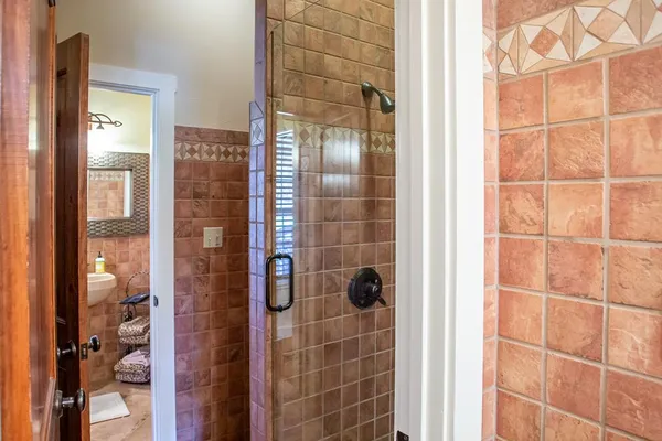 a view of a field with trees in background