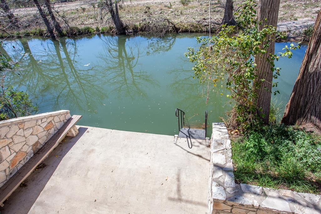 475 River Bend Road West Hunt, TX 78024 - Photo 64 of 87 a view of a swimming pool with a patio