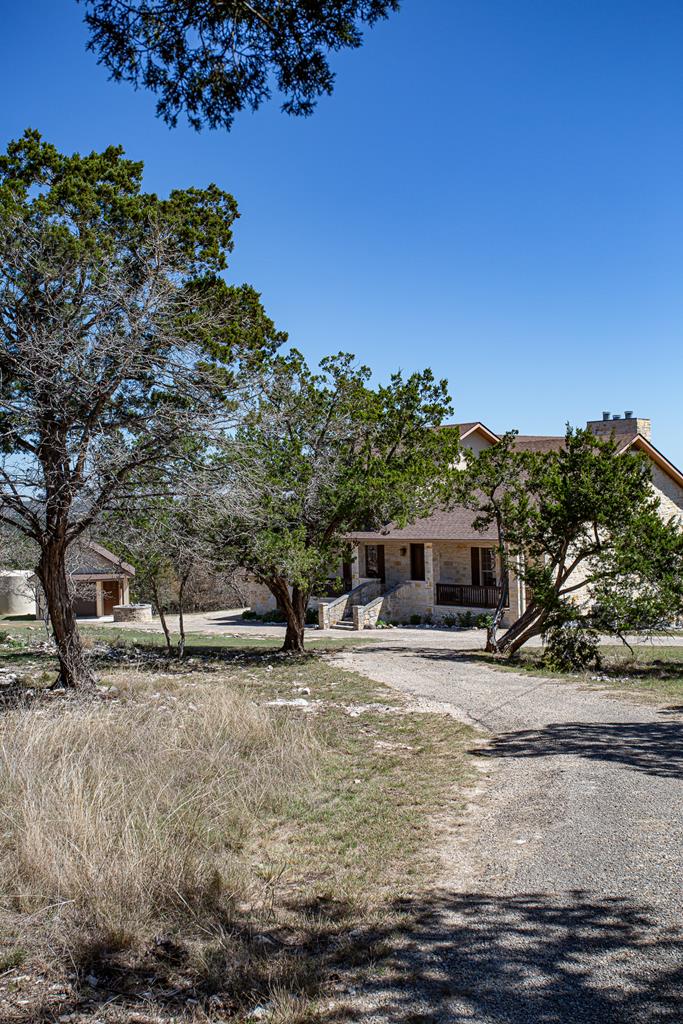 475 River Bend Road West Hunt, TX 78024 - Photo 79 of 87 a backyard of a house with yard and outdoor seating