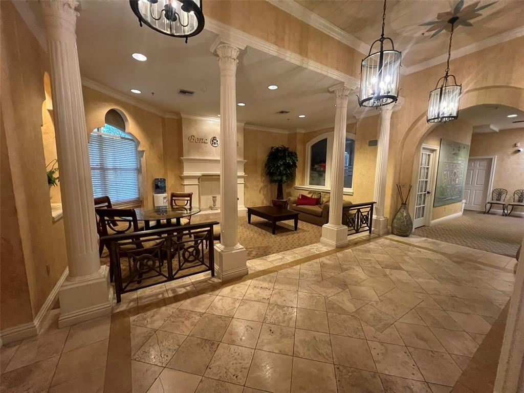 824 Camargo Way, Unit 211 Altamonte Springs, FL 32714 - Photo 12 of 24 a lobby with furniture and a chandelier
