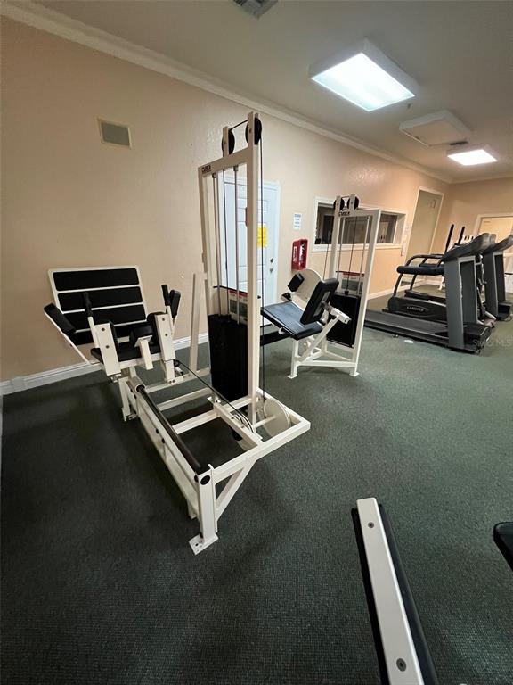 824 Camargo Way, Unit 211 Altamonte Springs, FL 32714 - Photo 15 of 24 a room with gym equipment