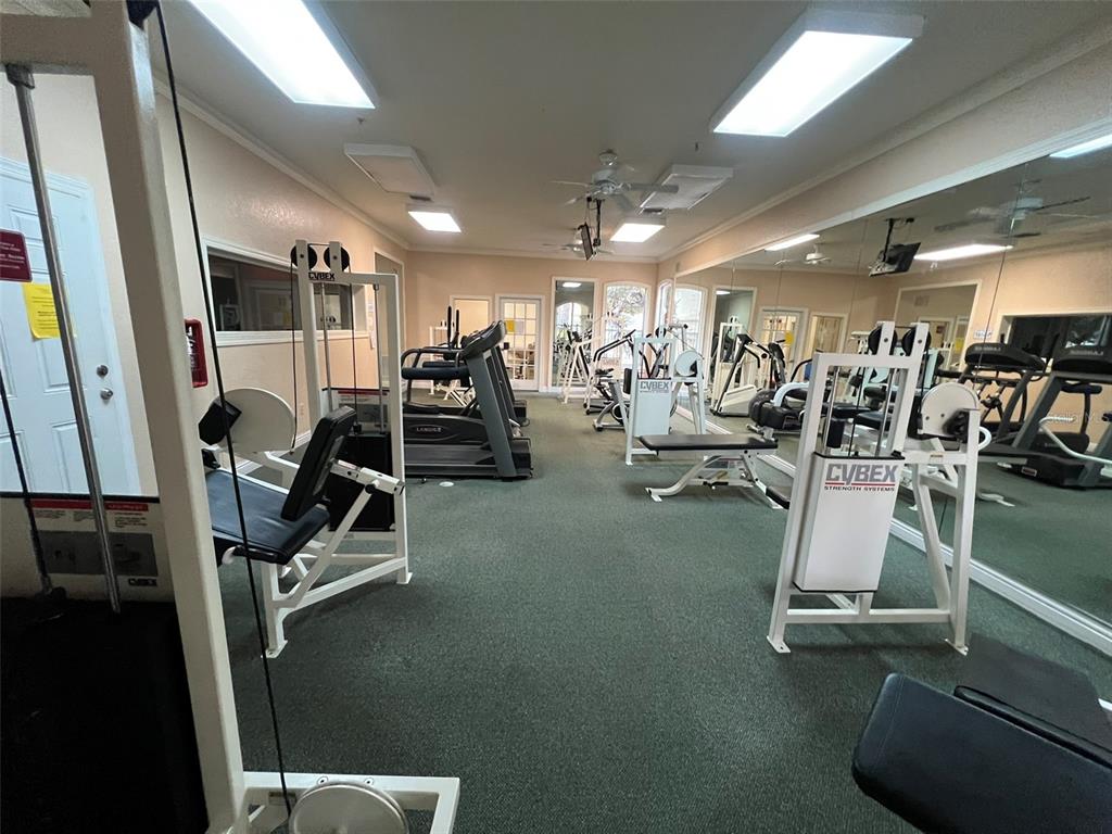 824 Camargo Way, Unit 211 Altamonte Springs, FL 32714 - Photo 17 of 24 a view of a room with gym equipment