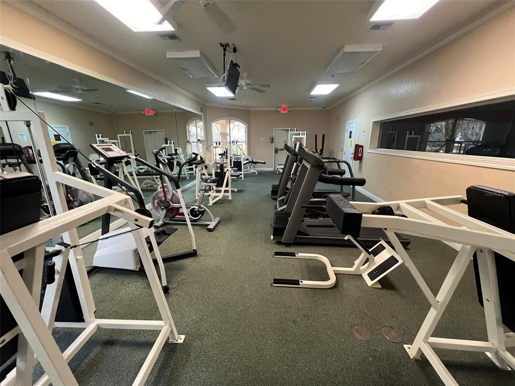 824 Camargo Way, Unit 211 Altamonte Springs, FL 32714 - Photo 18 of 24 a view of a room with gym equipment