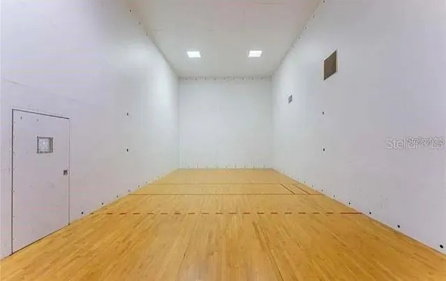 a swimming pool with outdoor seating and yard