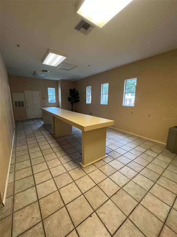 824 Camargo Way, Unit 211 Altamonte Springs, FL 32714 - Photo 23 of 24 a living room with a table and chairs