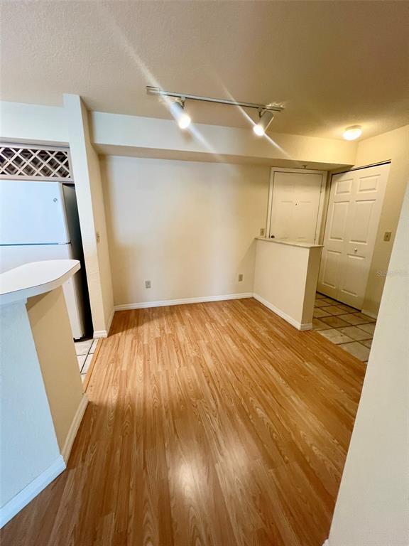 824 Camargo Way, Unit 211 Altamonte Springs, FL 32714 - Photo 7 of 24 a view of empty room with wooden floor