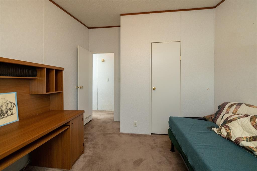 207 Lazy B Lane Springtown, TX 76082 - Photo 27 of 39 Carpeted bedroom featuring crown molding