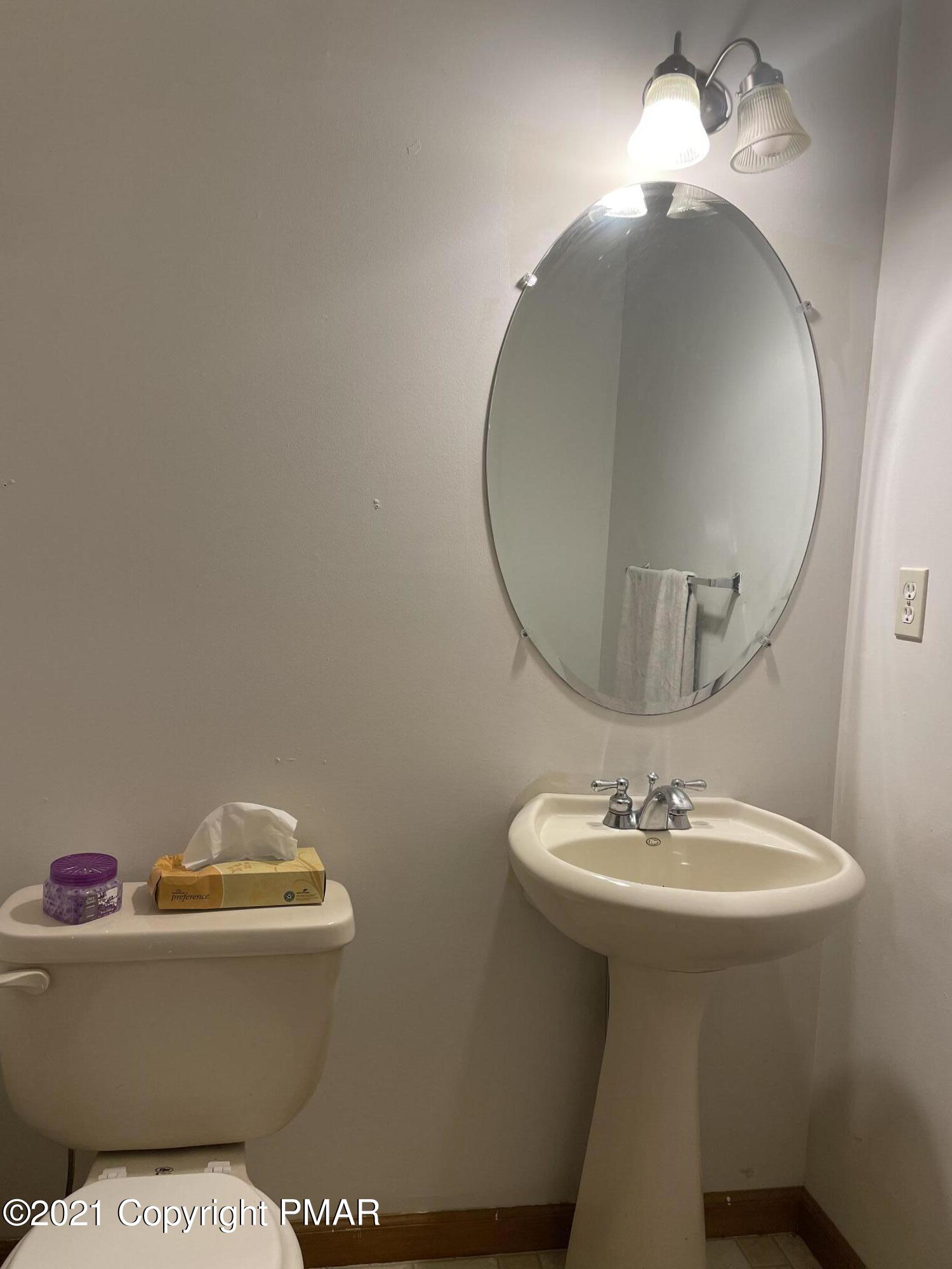 3294 Red Run Road Pocono Summit, PA 18346 - Photo 23 of 36 a bathroom with a sink and a mirror