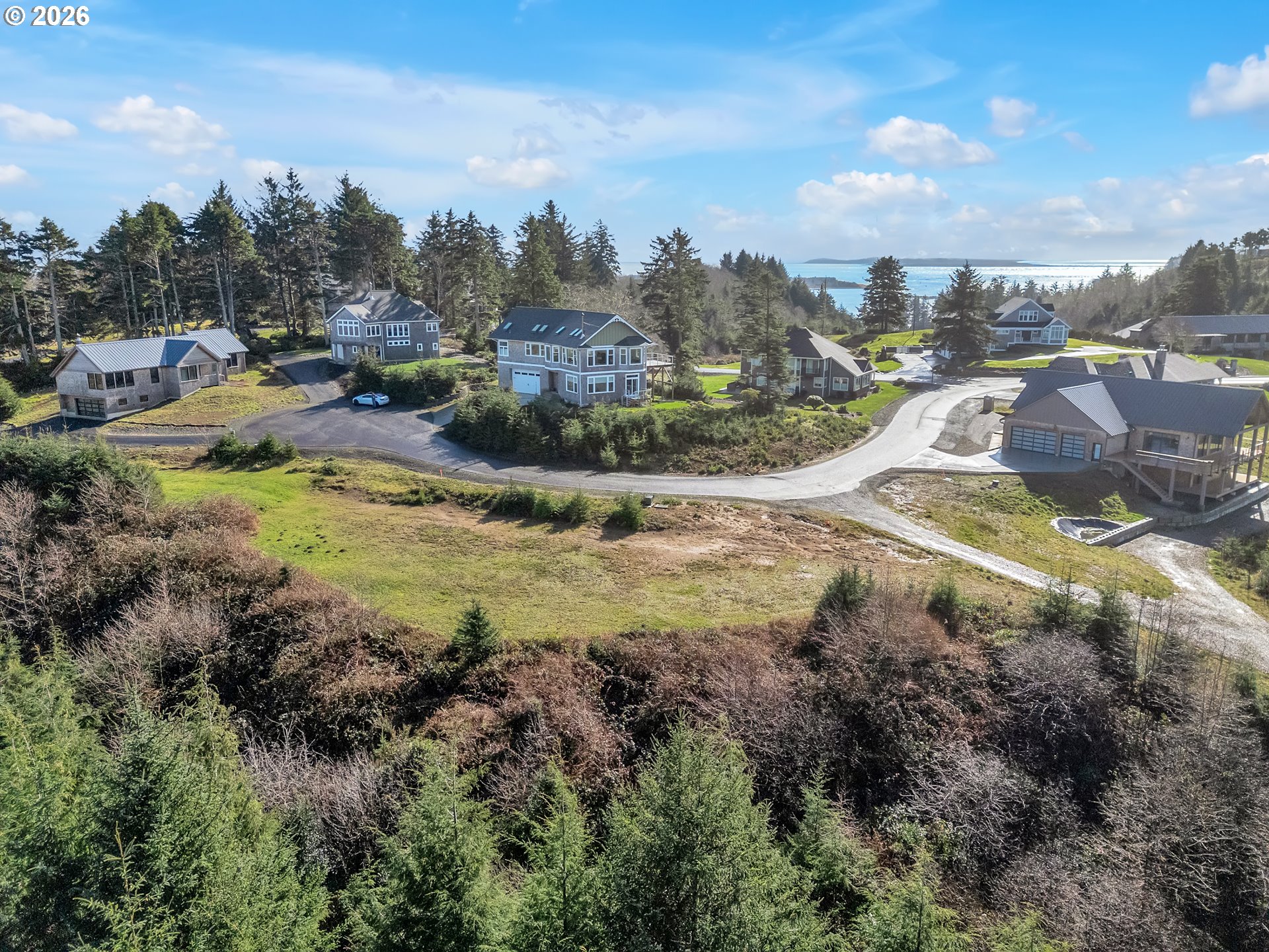 3038 Ocean View Court Ilwaco, WA 98624 - Photo 1 of 16 a view of a town with residential houses