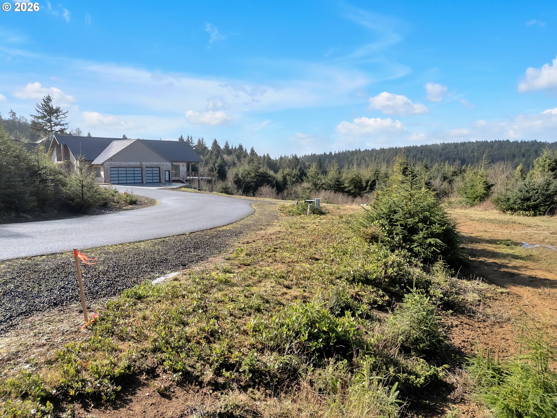 3038 Ocean View Court Ilwaco, WA 98624 - Photo 5 of 16 a view of a town with mountains in the background