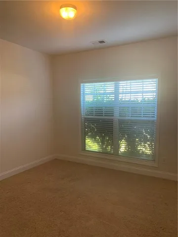 an empty room with closet area