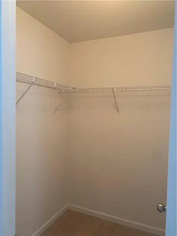 a view of an empty room and a window