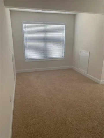 a bathroom with bathtub and window