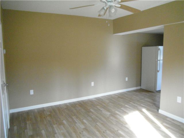 523 South Spring Street Manchester, TN 37355 - Photo 2 of 9 Living area leading into kitchen and utility room
