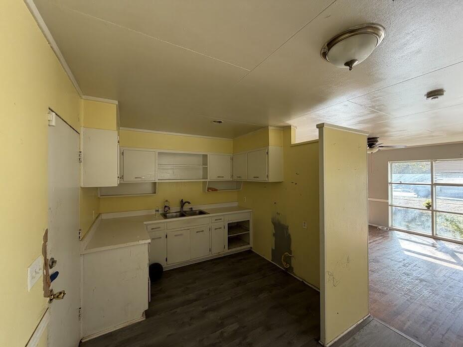 2014 West 20th Plainview, TX 79072 - Photo 3 of 7 a kitchen with a sink stainless steel appliances and cabinets