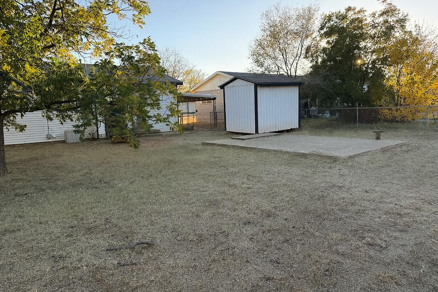 2014 West 20th Plainview, TX 79072 - Photo 7 of 7 a view of a house with a yard and garage