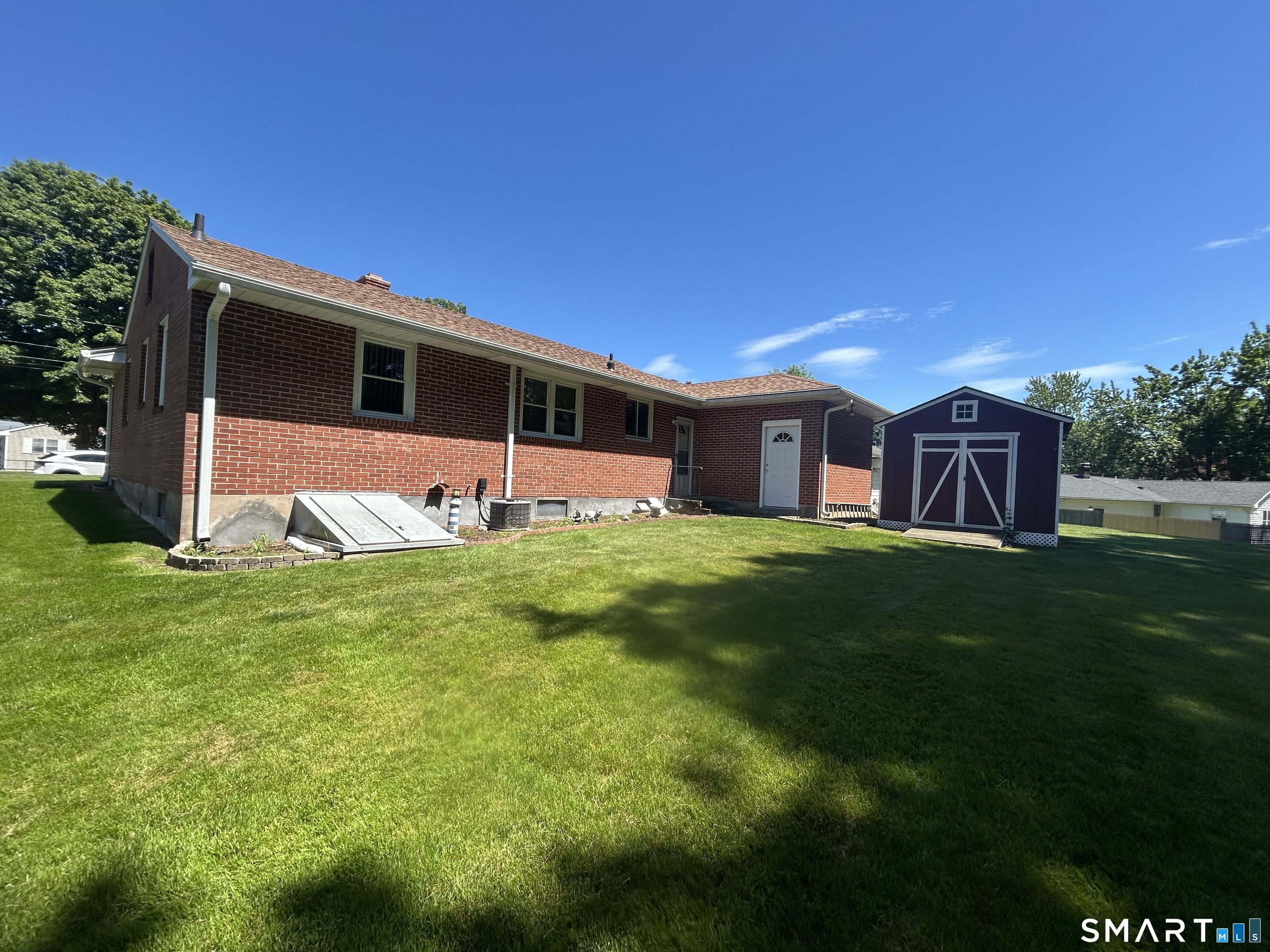 13 Walnut Lane Wallingford, CT 06492 - Photo 24 of 27 a front view of house with yard and green space