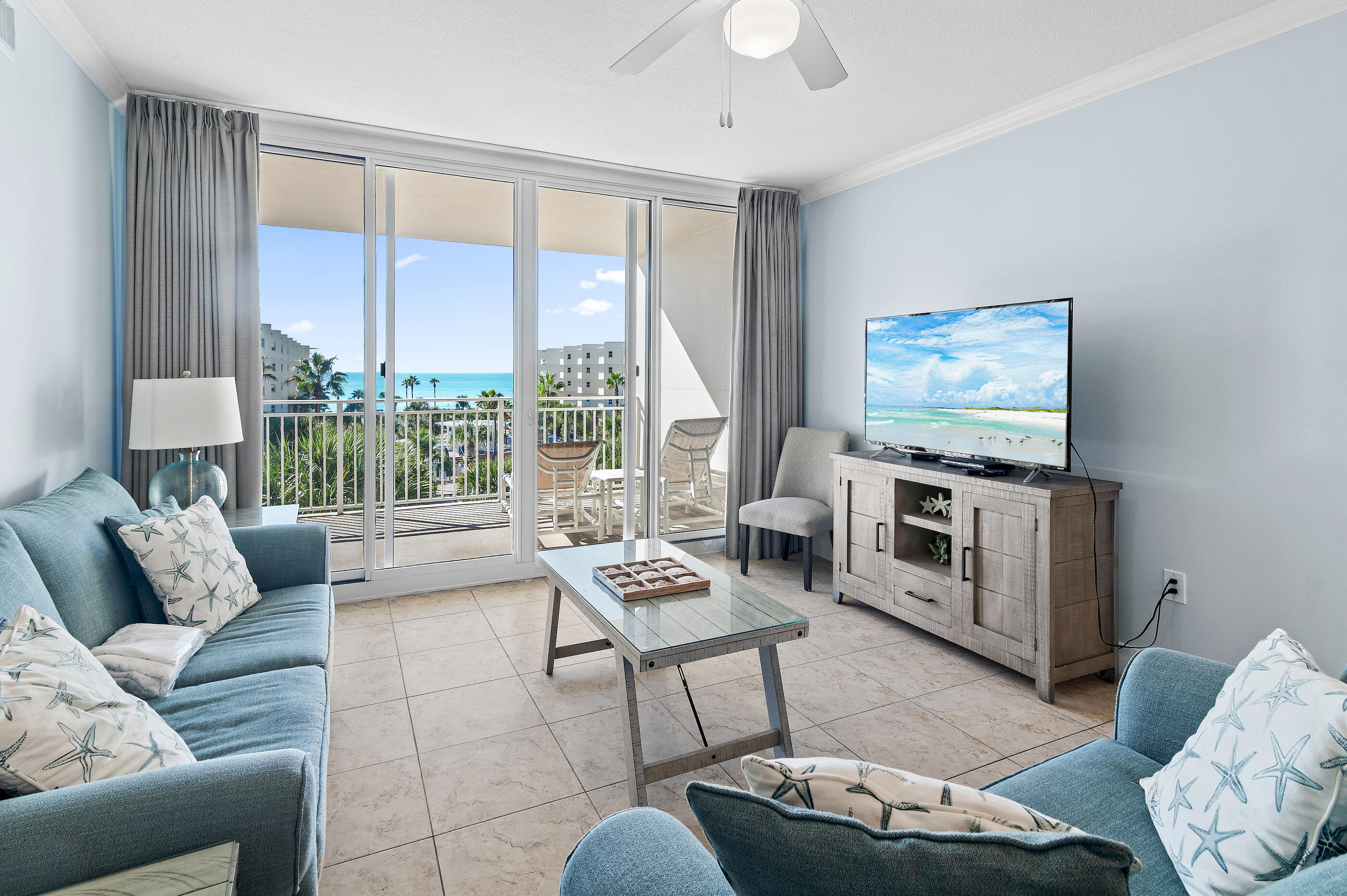 1110 Santa Rosa Boulevard, Unit C500 Fort Walton Beach, FL 32548 - Photo 1 of 59 a living room with furniture and a flat screen tv
