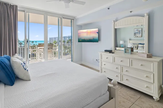 a bedroom with a bed and a dresser