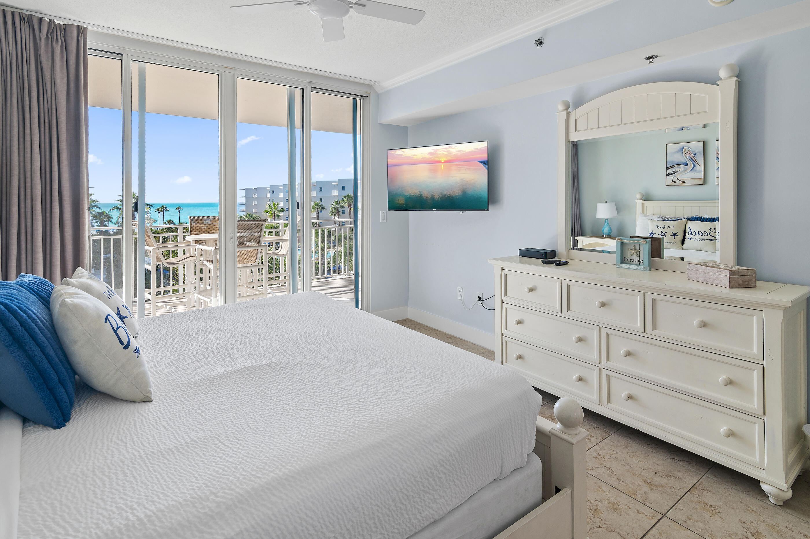 1110 Santa Rosa Boulevard, Unit C500 Fort Walton Beach, FL 32548 - Photo 19 of 59 a bedroom with a bed and a flat screen tv