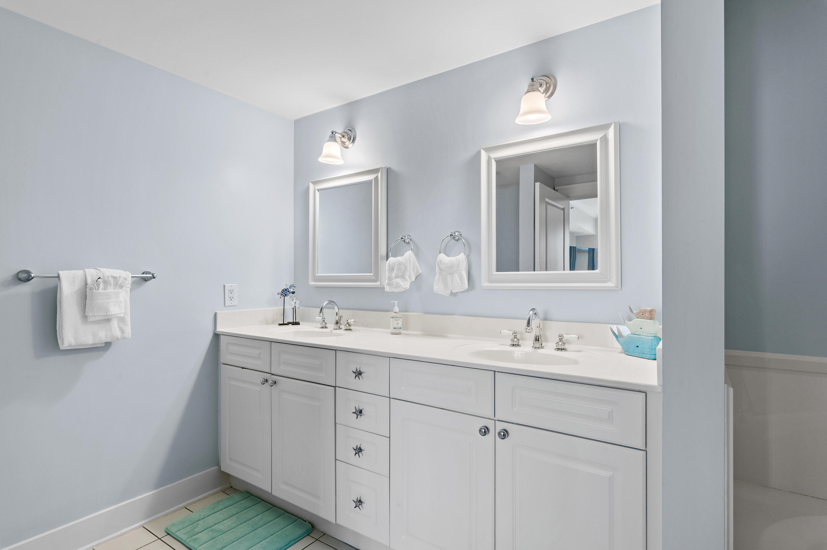 1110 Santa Rosa Boulevard, Unit C500 Fort Walton Beach, FL 32548 - Photo 23 of 59 a bathroom with a sink and a mirror