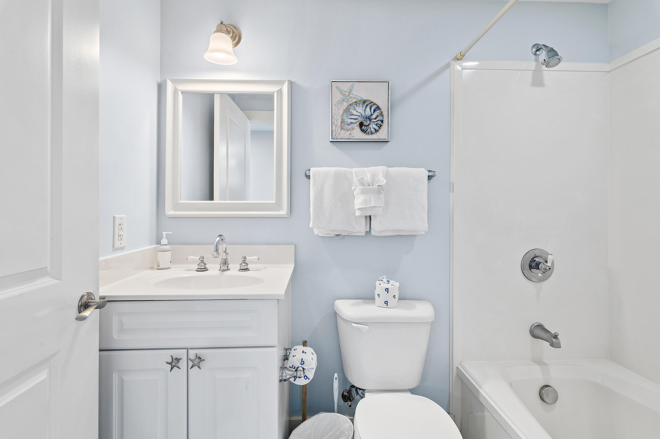 1110 Santa Rosa Boulevard, Unit C500 Fort Walton Beach, FL 32548 - Photo 24 of 59 a bathroom with a toilet sink and mirror