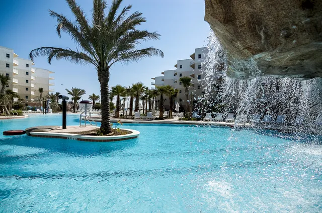 a swimming pool with outdoor seating yard and barbeque oven