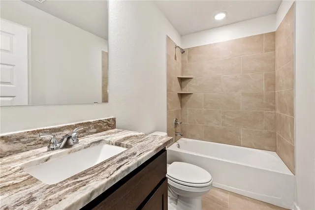 a view of an empty room and a window