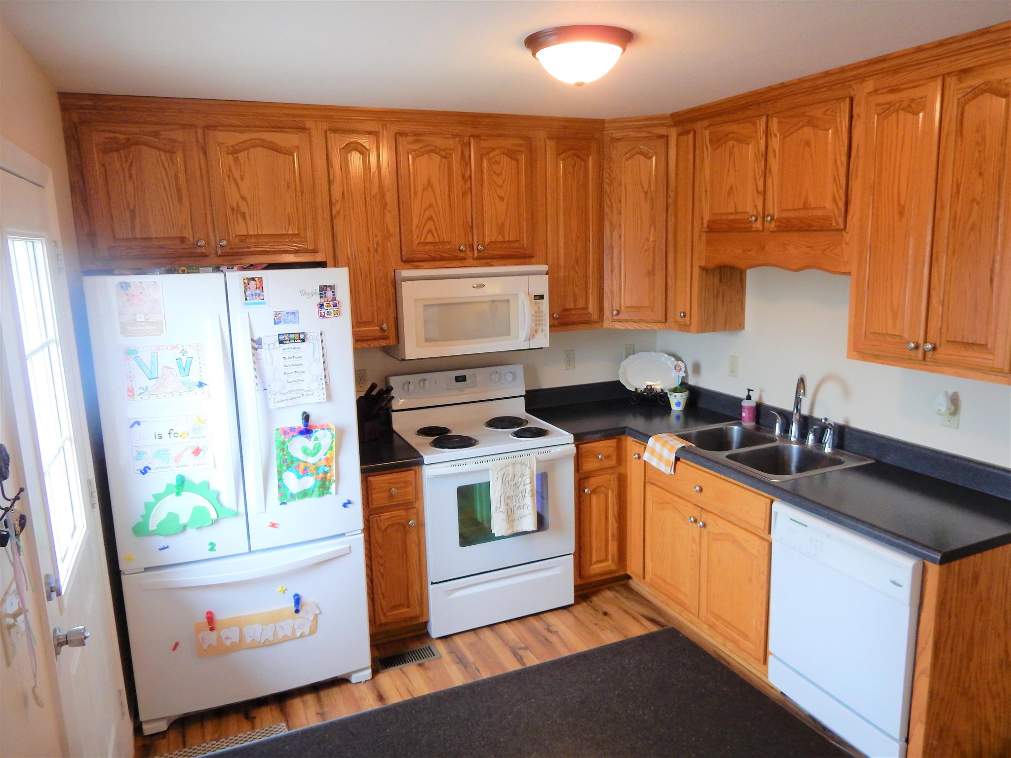 11 Heather Road Fayetteville, TN 37334 - Photo 14 of 20 a kitchen with stainless steel appliances a stove a sink and a refrigerator