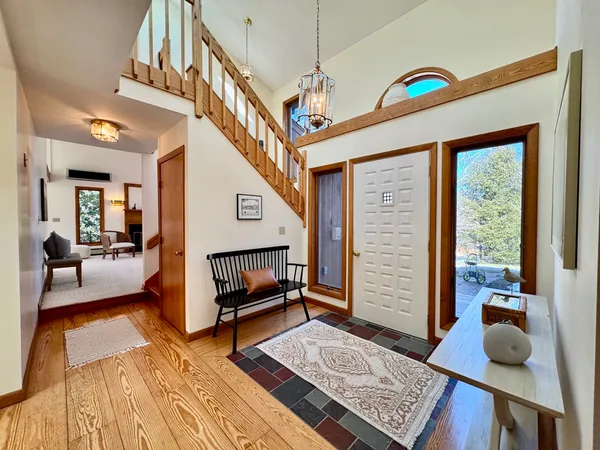 a living room with furniture rug and a large window