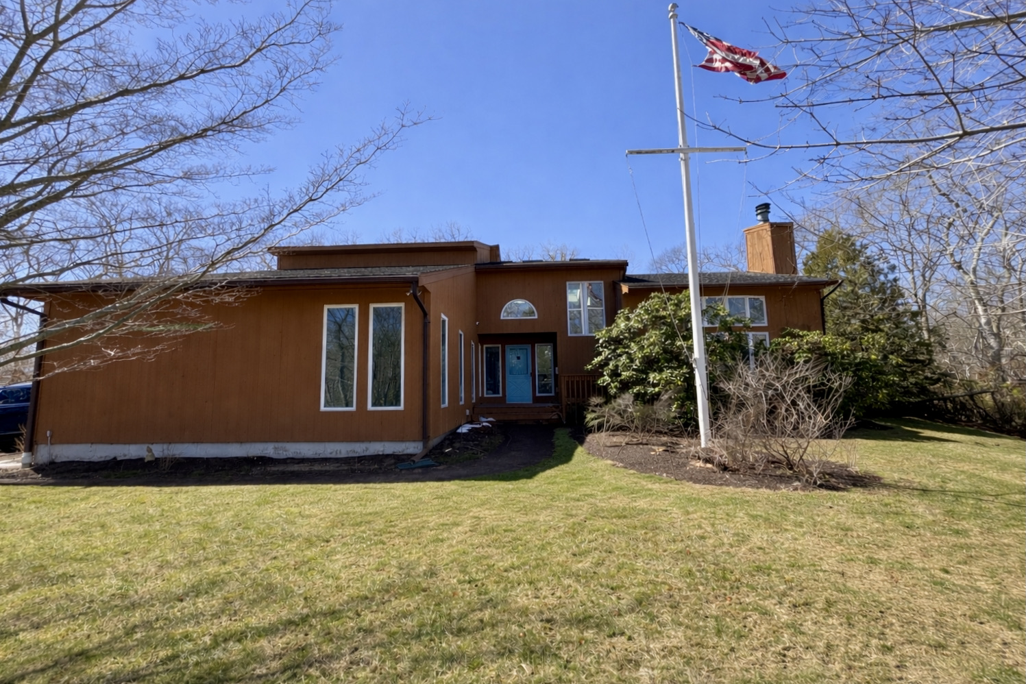 103 Meadow View Road Oak Bluffs, MA 02557 - Photo 22 of 26 a front view of a house with a yard