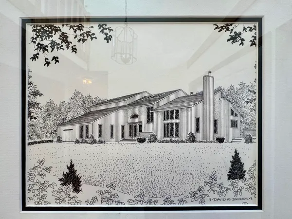 a view of a and white house with a outdoor space