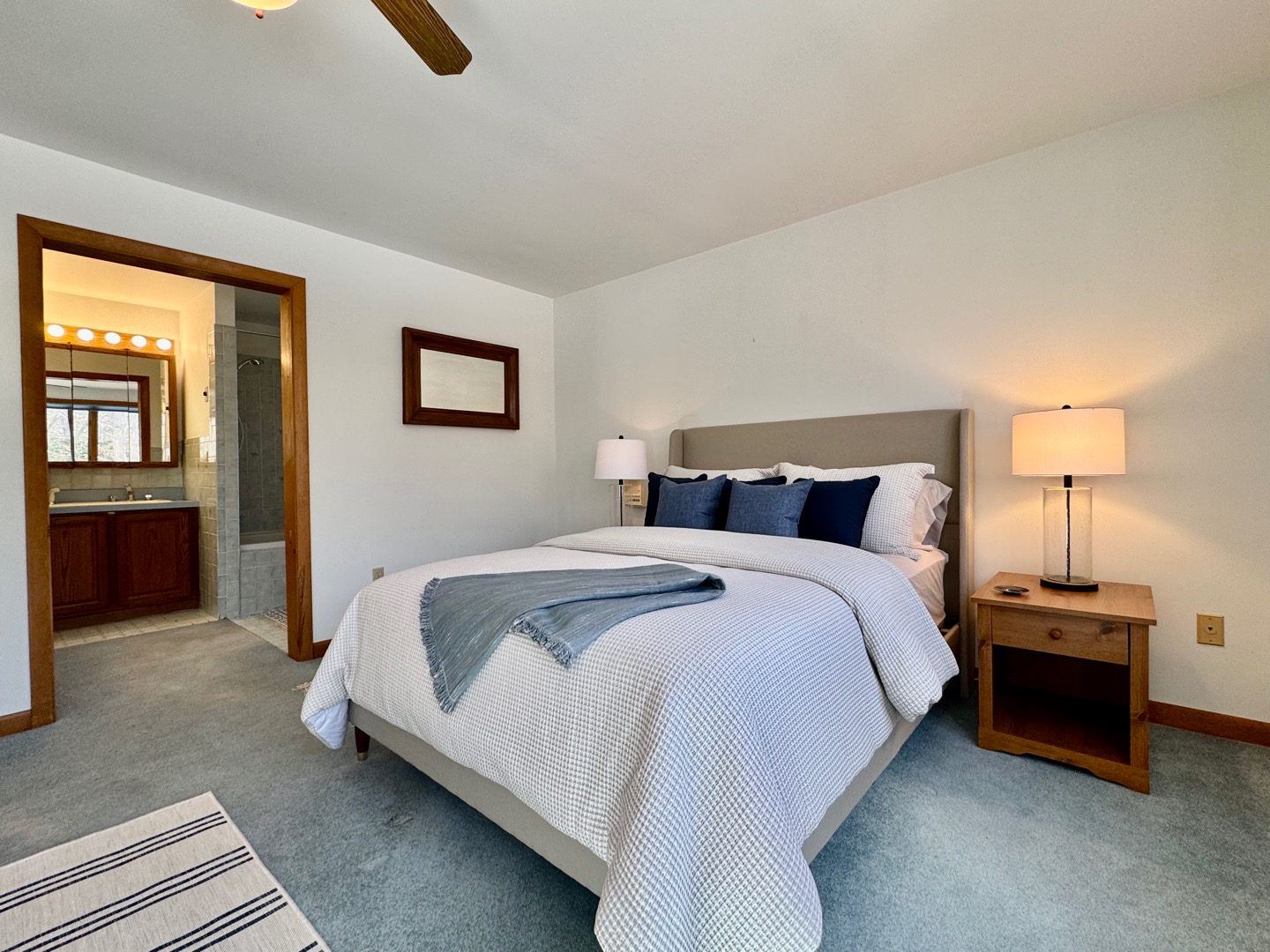 103 Meadow View Road Oak Bluffs, MA 02557 - Photo 10 of 26 a bedroom with a bed and painting on the wall