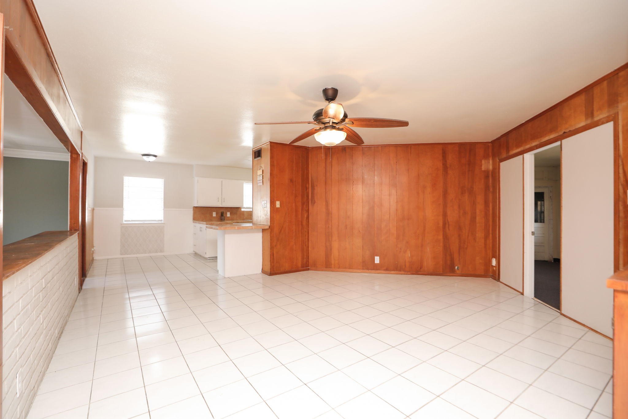 8235 Dover Street Houston, TX 77061 - Photo 10 of 36 a view of a kitchen with a sink and a chandelier