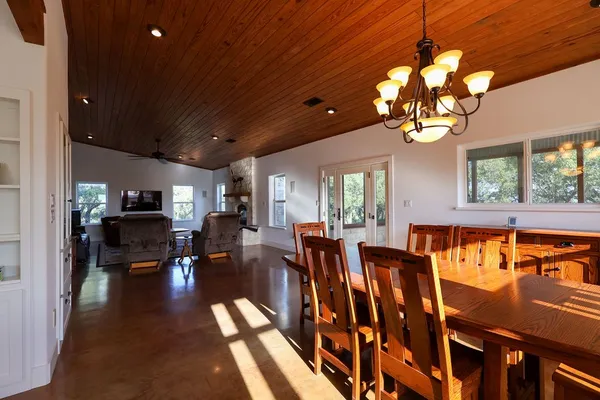 a kitchen with granite countertop a sink stainless steel appliances and white cabinets