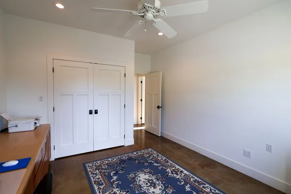 a bedroom with a bed window and a window