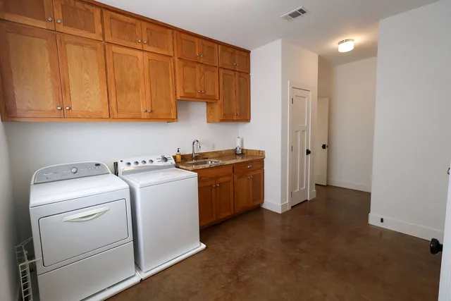 a view of a kitchen from the hallway