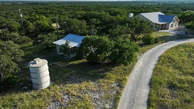a backyard of a house with a yard and lake view
