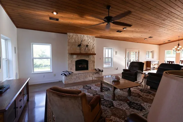 a living room with a fireplace and a window