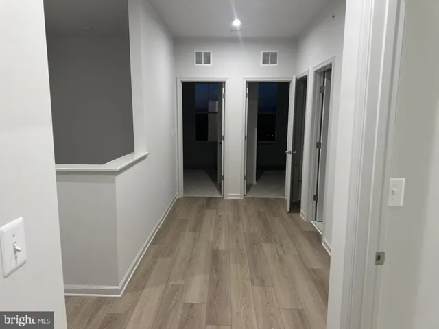 a view of hallway with walk in closet