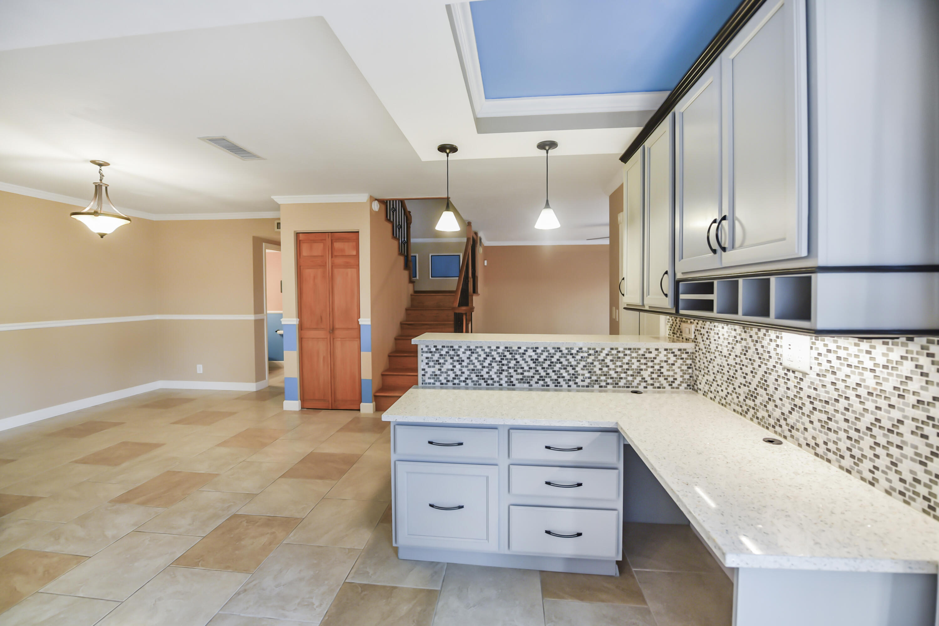 102 Woodland Road Palm Springs, FL 33461 - Photo 14 of 41 a spacious bathroom with a double vanity sink and a mirror