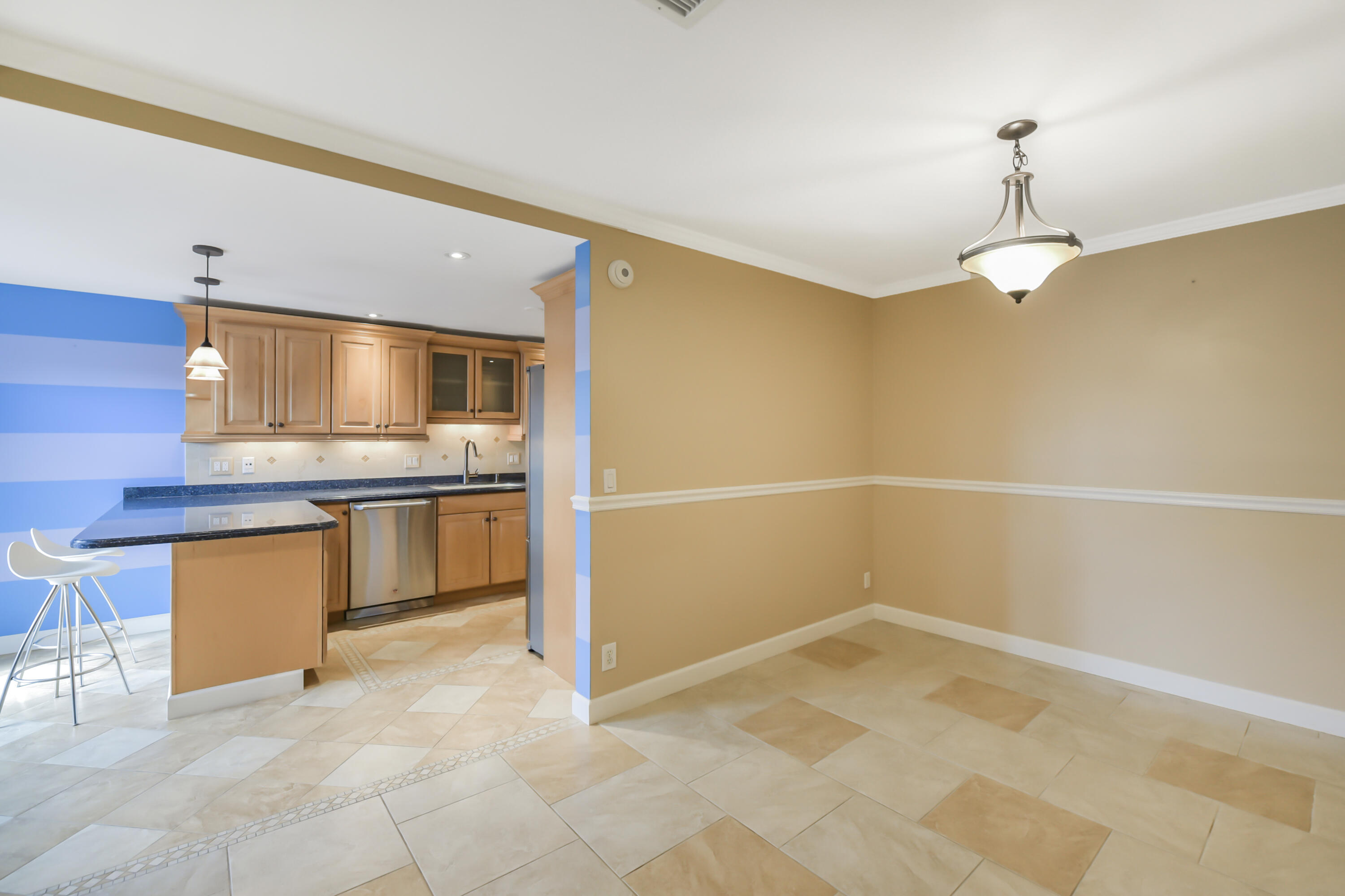 102 Woodland Road Palm Springs, FL 33461 - Photo 16 of 41 a view of a kitchen with a sink and dishwasher
