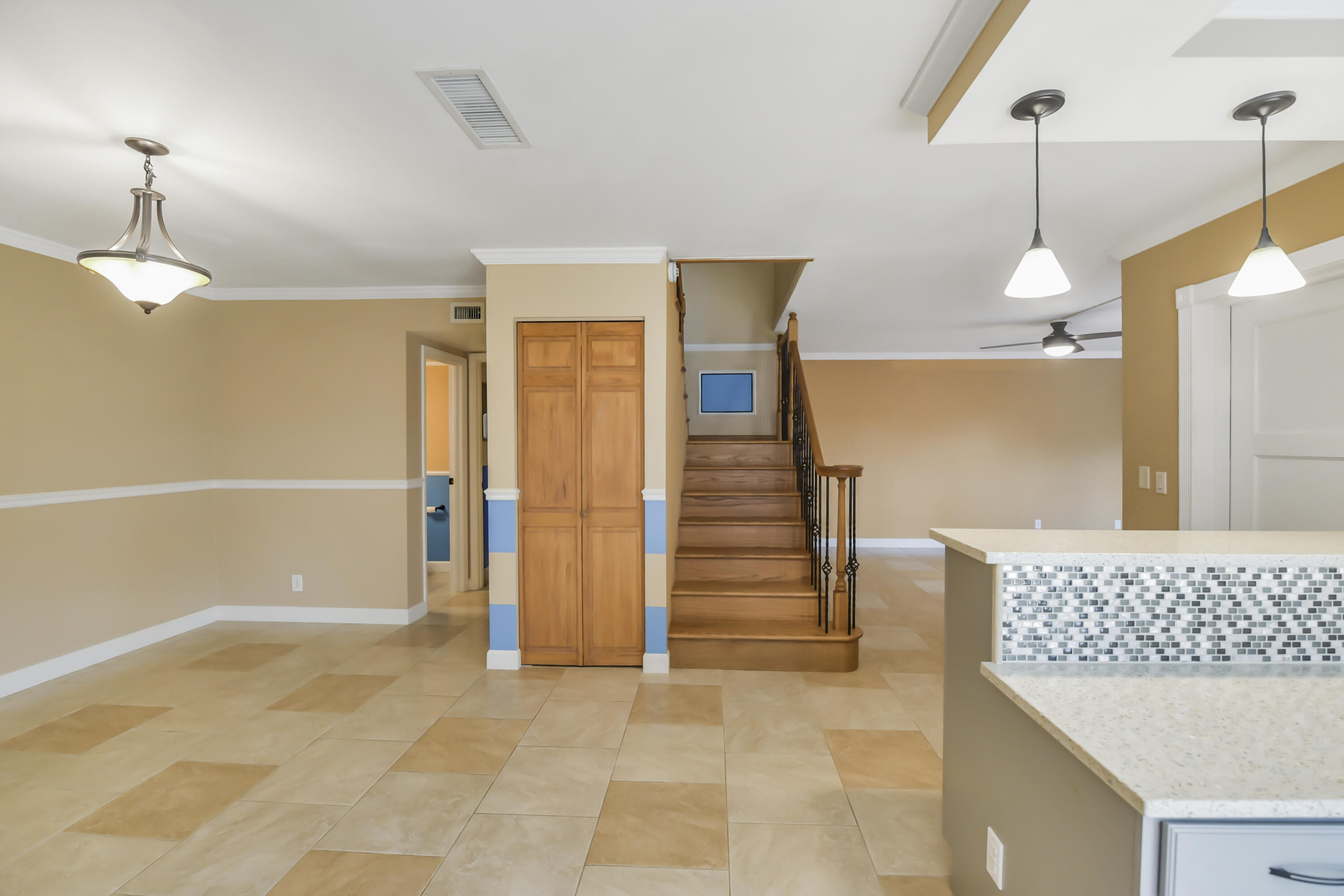 102 Woodland Road Palm Springs, FL 33461 - Photo 19 of 41 a view of a kitchen with furniture and an empty room