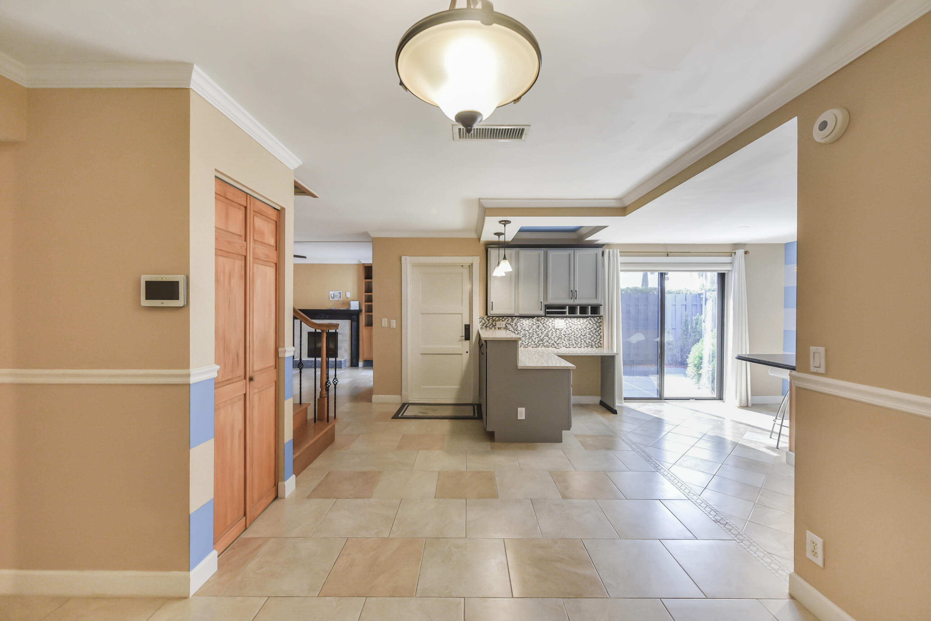102 Woodland Road Palm Springs, FL 33461 - Photo 24 of 41 a view of a kitchen center island cabinets and refrigerator