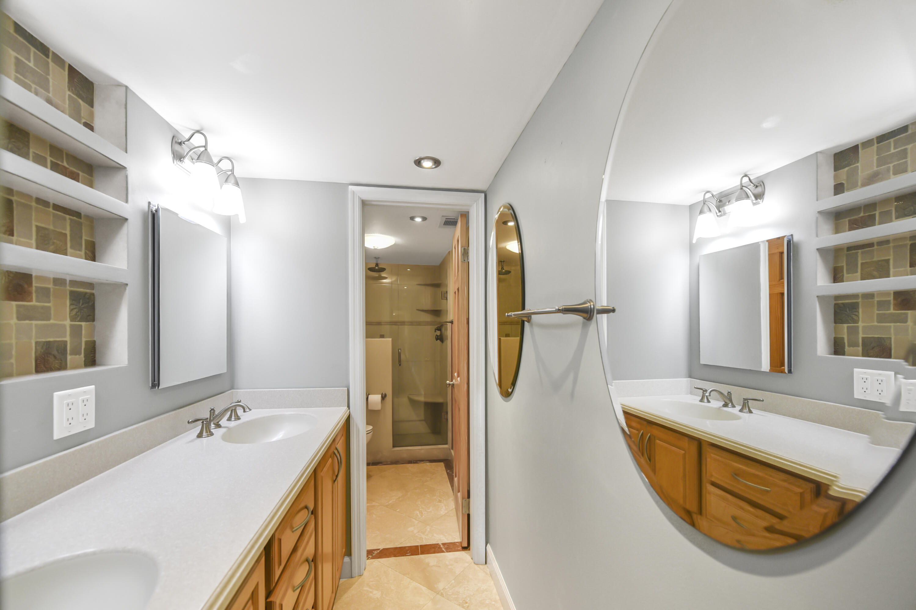 102 Woodland Road Palm Springs, FL 33461 - Photo 32 of 41 a bathroom with a tub sink and mirror