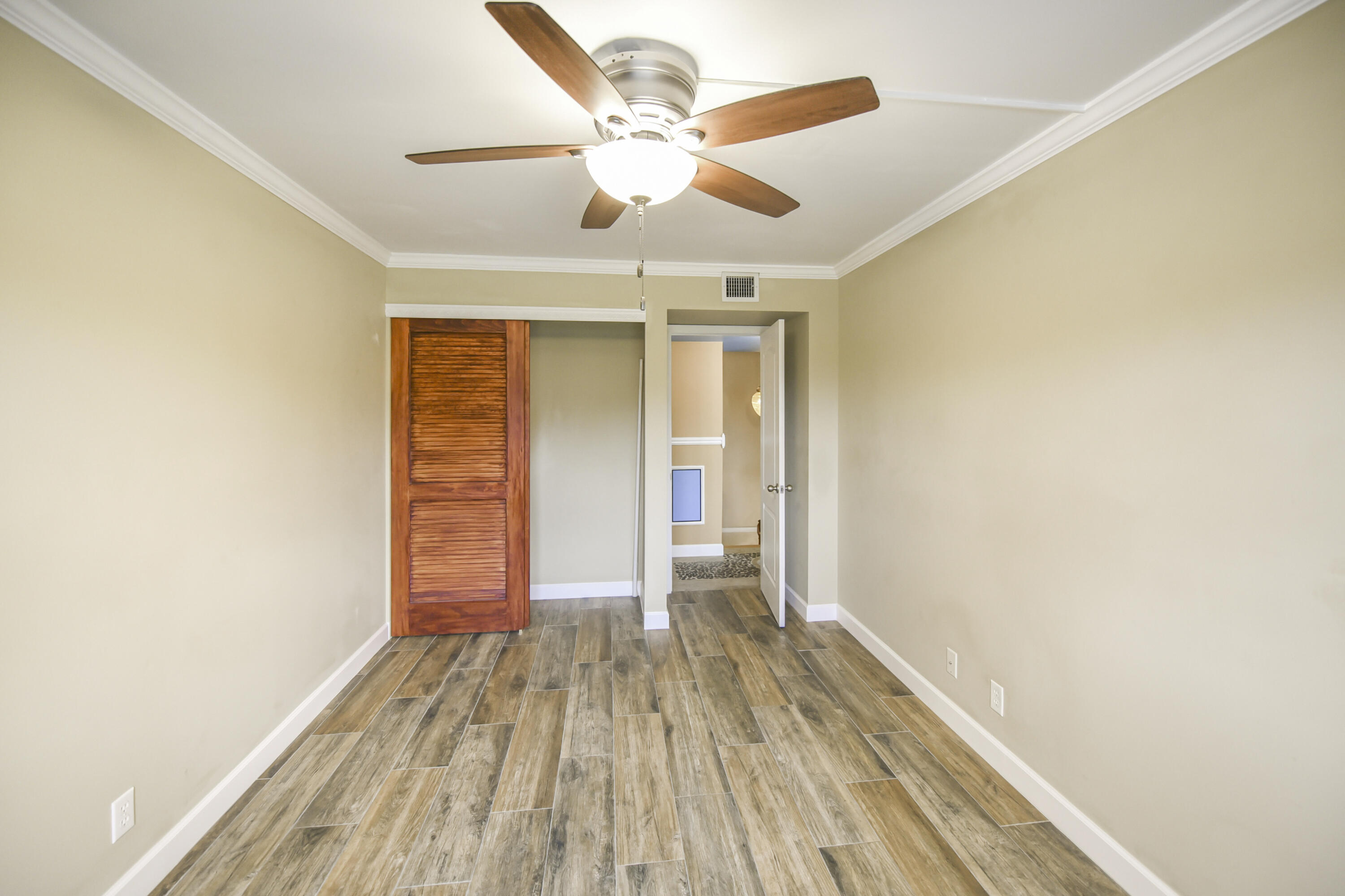 102 Woodland Road Palm Springs, FL 33461 - Photo 36 of 41 wooden floor in an empty room